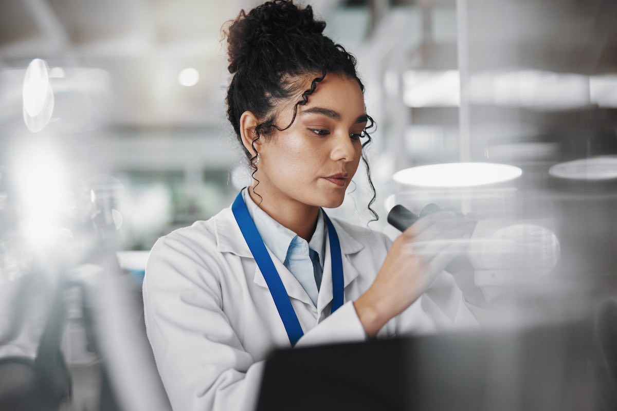 Lab Technician inspecting sample